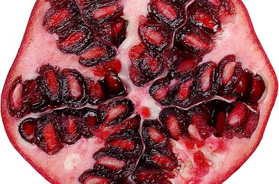 Zedcor Wholly Owned/PhotoObjects.net/Getty Images Pomegranates provide vitamin C, vitamin K, folate and potassium.
