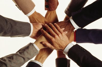 Jupiterimages/Photos.com/Getty Images Trust-building exercises help to develop strong teams.