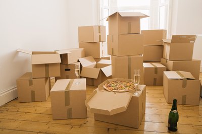 Jupiterimages/Pixland/Getty Images A cheap long-distance moving service won't break your back or your budget.