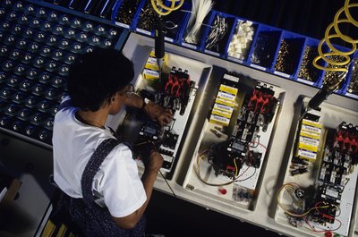 Kim Steele/Photodisc/Getty Images More than strength is required to be a production worker.