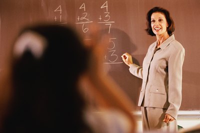 Stockbyte/Stockbyte/Getty Images Over 50 percent of math teachers have a Master's Degree or higher, which gives them the opportunity to pursue different occupations. (See References 1)