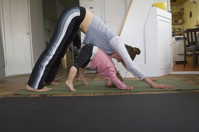 Thinkstock Images/Comstock/Getty Images Downward-Facing Dog pose can help loosen and lengthen tight hamstrings