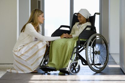 Goodshoot/Goodshoot/Getty Images Use FMLA if you need time off from work to care for a family member.