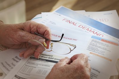 Andrew Bret Wallis/Brand X Pictures/Getty Images A home budget helps you manage bills.
