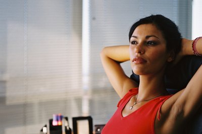 George Doyle/Stockbyte/Getty Images Release tight shoulders with feel-good desk stretches.