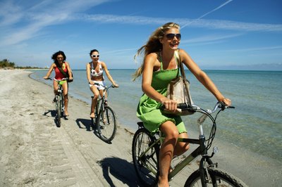 Kraig Scarbinsky/Digital Vision/Getty Images Walking and cycling are both healthy cardio choices.