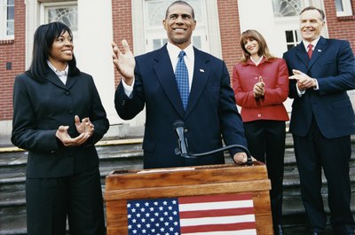 Digital Vision./Digital Vision/Getty Images Politicians debate during campaigns and throughout their office terms.