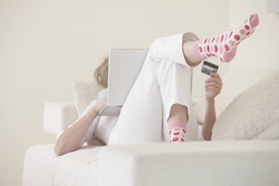 Andrew Bret Wallis/Brand X Pictures/Getty Images Keeping your balances down improves your credit score.