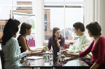 Digital Vision./Digital Vision/Getty Images A magazine publisher meets regularly with staff on editorial and business issues.