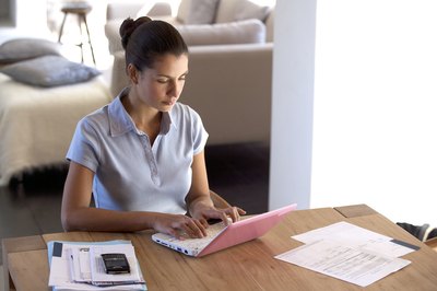 Alistair Berg/Digital Vision/Getty Images Changing the terms of your mortgage loan can save you money.