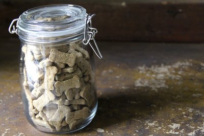 ErimacGroup/iStock/Getty Images Containers with tight fitting lids seal in freshness and cut down dog food odors.