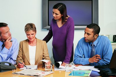 Digital Vision./Digital Vision/Getty Images It's important you take care of yourself at work while pregnant.