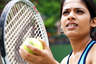 Visage/Stockbyte/Getty Images Improve your serve to win more matches.