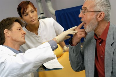 Medioimages/Photodisc/Photodisc/Getty Images Dental hygienists help dentists discover tooth problems.