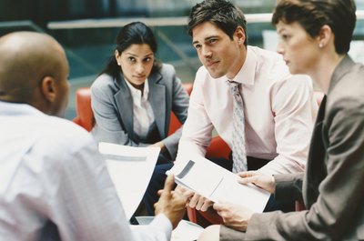 Digital Vision./Digital Vision/Getty Images New employees should read their group plans carefully for portability options.