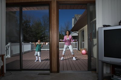 Baerbel Schmidt/Photodisc/Getty Images Reflective window film offers a small boost to R-value and significantly reduces solar gain.
