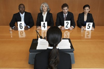 Noel Hendrickson/Photodisc/Getty Images A scripted interview sheet is helpful when you have multiple interviewers.