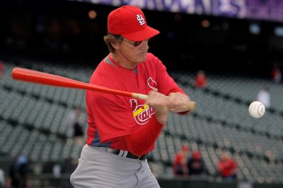 Doug Pensinger/Getty Images Sport/Getty Images Former St. Louis Cardinals manager Tony La Russa uses a fungo bat for fielding practice before a game.