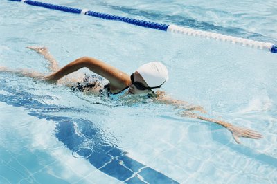 Digital Vision./Digital Vision/Getty Images Swimming is a full-body exercise that also improves cardiovascular health.
