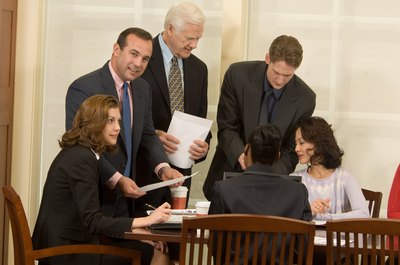 Jupiterimages/Photos.com/Getty Images Paralegals prepare research, documents and reports for a firm's lawyers.