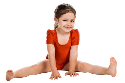 PhotoObjects.net/PhotoObjects.net/Getty Images The sitting straddle is one of four basic sitting gymnastic positions.