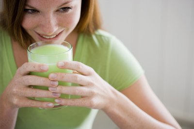 Jupiterimages/Pixland/Getty Images Drink a vegetable smoothie in place of a sugary treat for weight loss.