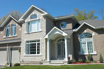 Hemera Technologies/Photos.com/Getty Images A loan modification lowers your monthly payments so you can avoid foreclosure.