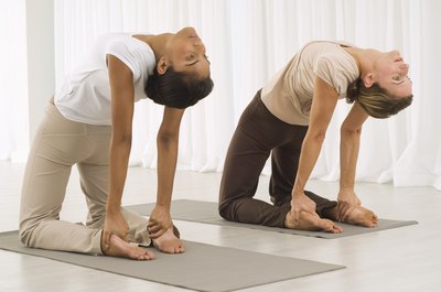 Jupiterimages/Pixland/Getty Images Stretching your spine can help lengthen the muscles that support your posture.