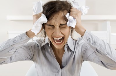 Pixland/Pixland/Getty Images It's often difficult to restrain your emotions at work.