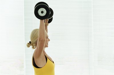 Polka Dot Images/Polka Dot/Getty Images Use a variety of equipment at your local gym for a killer upper body workout.