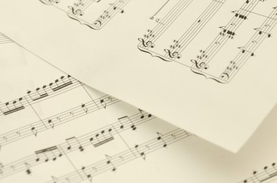 Hemera Technologies/AbleStock.com/Getty Images Song royalties are often divided between the writer and composer.