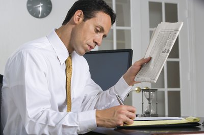 Jupiterimages/Creatas/Getty Images Observe the rating that financial analysts assign a stock.
