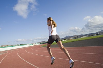Polka Dot Images/Polka Dot/Getty Images The best track surfaces are long lasting and reduce the risk of injury.