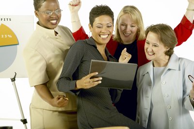 Dynamic Graphics/Dynamic Graphics Group/Getty Images Slogans for workplace improvement should inspire and energize your staff.