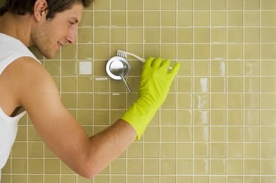 Jupiterimages/Polka Dot/Getty Images Baking soda and vinegar are inexpensive and non-toxic shower cleaners.