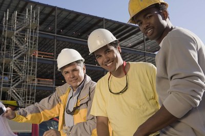 Jupiterimages/Comstock/Getty Images Workers' compensation insurance pays medical costs if you are hurt on the job