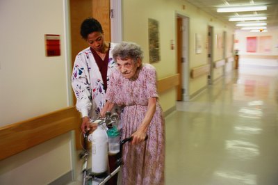 Stockbyte/Stockbyte/Getty Images CNAs help care for the elderly and disabled.