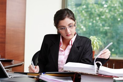Visage/Stockbyte/Getty Images Productivity is an example of a positive habit in the workplace.