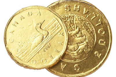 Hemera Technologies/PhotoObjects.net/Getty Images There are no restrictions preventing Americans from owning Canada government bonds.