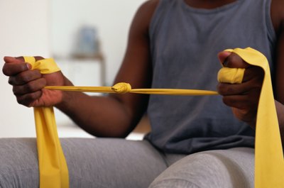 Keith Brofsky/Photodisc/Getty Images You can add resistance bands to the workout, if your machine is set up for it.