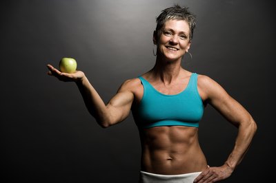 Jupiterimages/Photos.com/Getty Images Yoga and bodybuilding play well together.