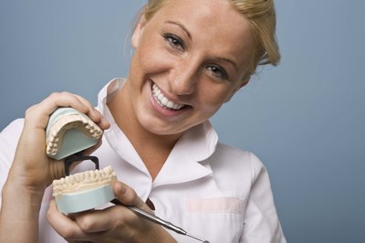 Jupiterimages/Goodshoot/Getty Images Dentists teach patients proper oral care.