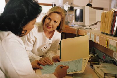 Comstock/Comstock/Getty Images Most medical coders work in modern health care facilities.