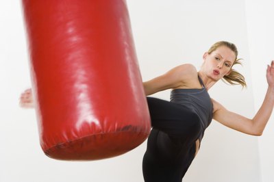 Jupiterimages/Pixland/Getty Images Effective kickboxing combinations can surprise an opponent.