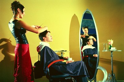 Thinkstock Images/Comstock/Getty Images Photo stylists make sure the set and design for a photo are perfect.