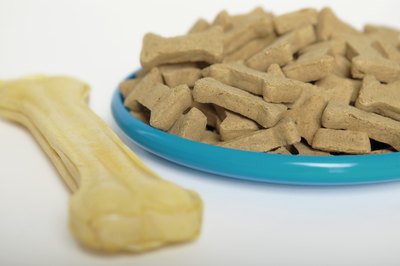 Jupiterimages/liquidlibrary/Getty Images Homemade dog treats don't have to cost a fortune to be healthy and taste great.