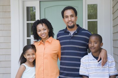 Jack Hollingsworth/Photodisc/Getty Images Homeowners insurance rates are based upon characteristics of you and your home.