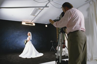 Photodisc/Photodisc/Getty Images Portrait photographers often work in studios.