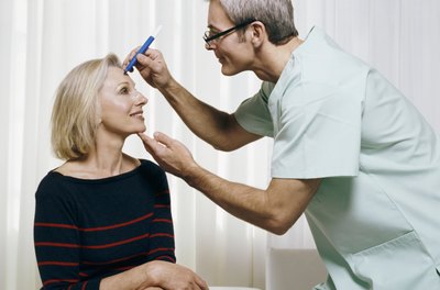 Digital Vision./Digital Vision/Getty Images Plastic surgeons can earn as much $500,000 a year.