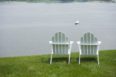 Jupiterimages/Comstock/Getty Images A chair gives you the opportunity to perform seated calf stretches wherever your heart desires.